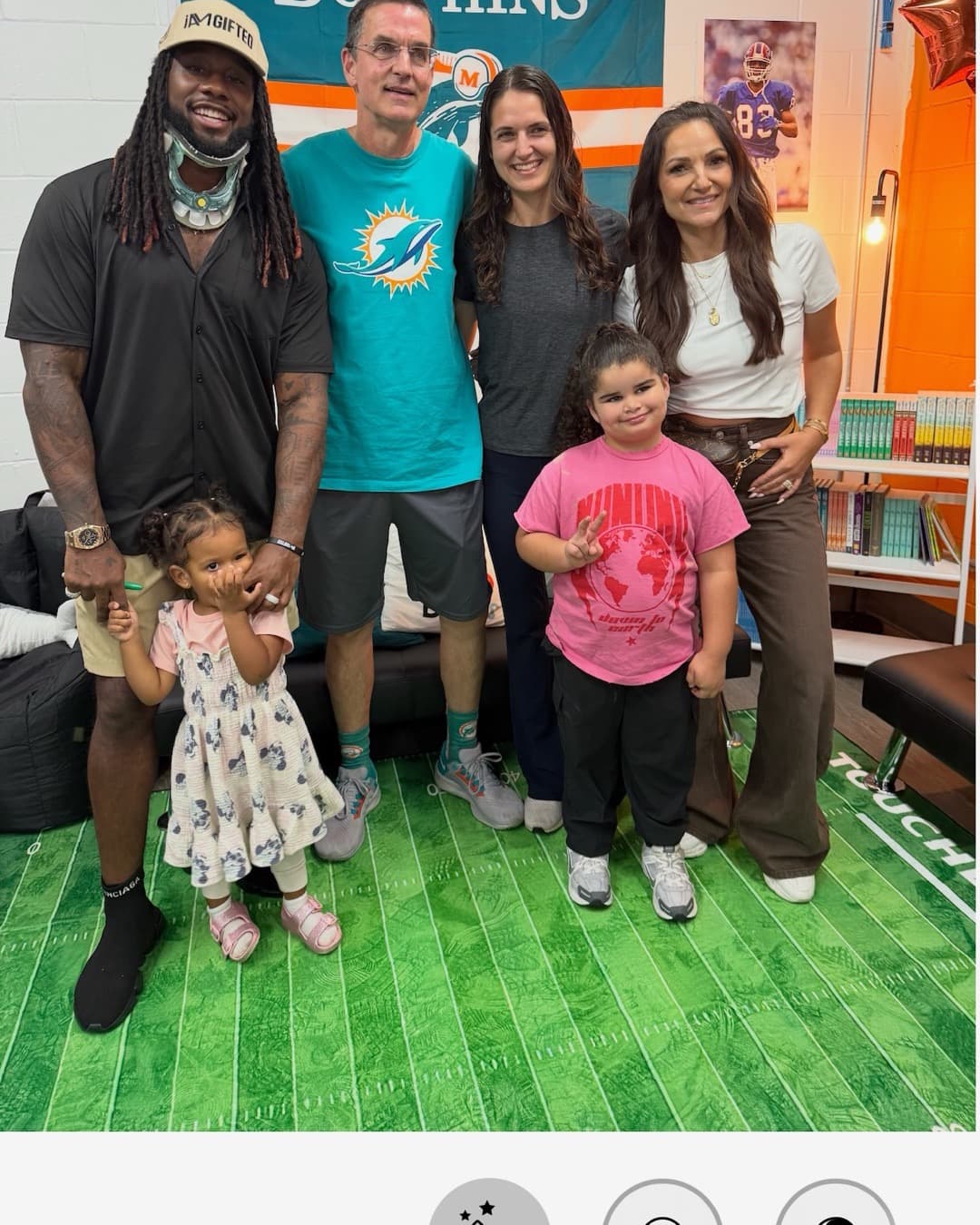Andre Reed with young readers at a Boys & Girls Club reading room