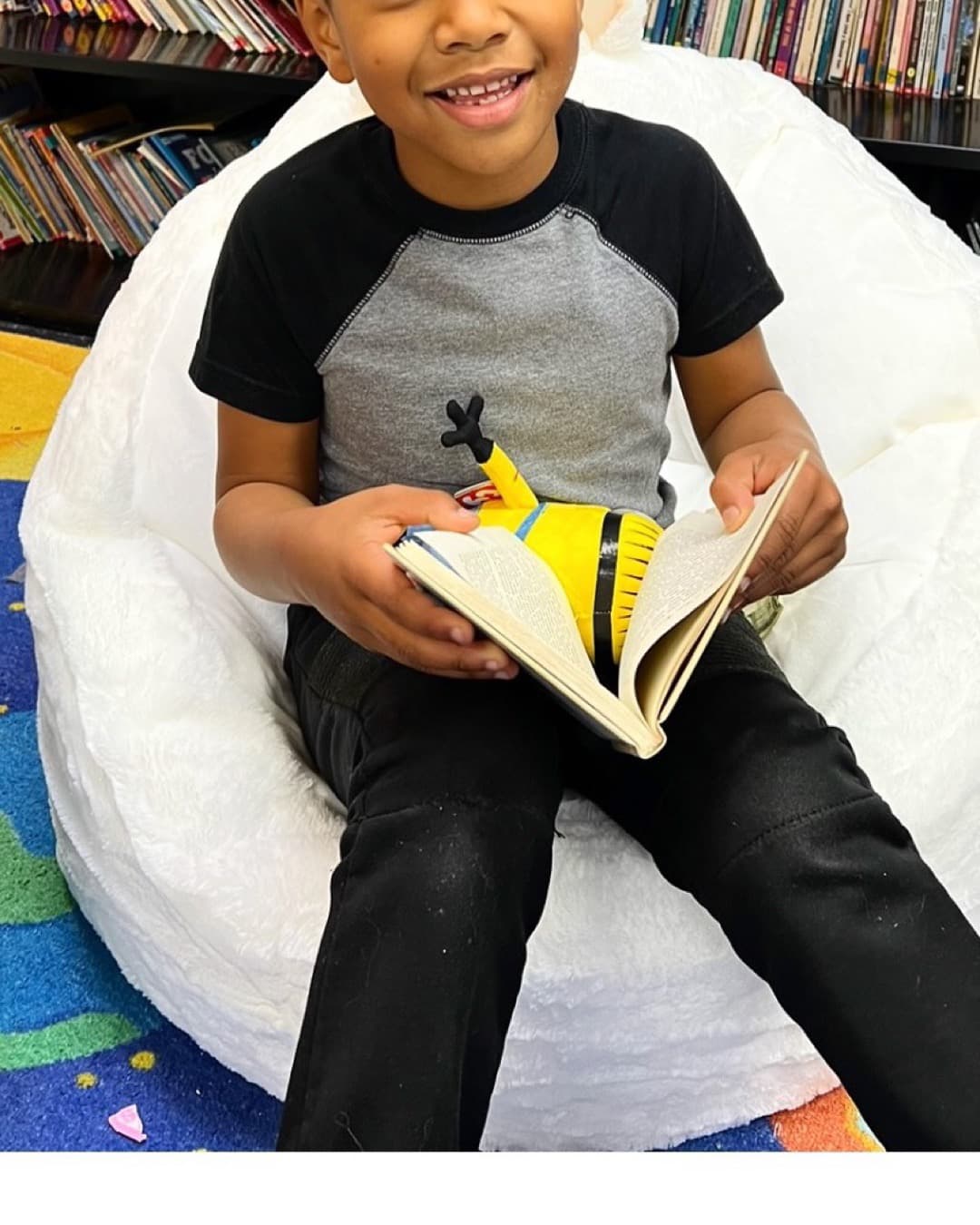 A boy settles into a beanbag with a book at the Solana Beach Boys & Girls Club reading nook